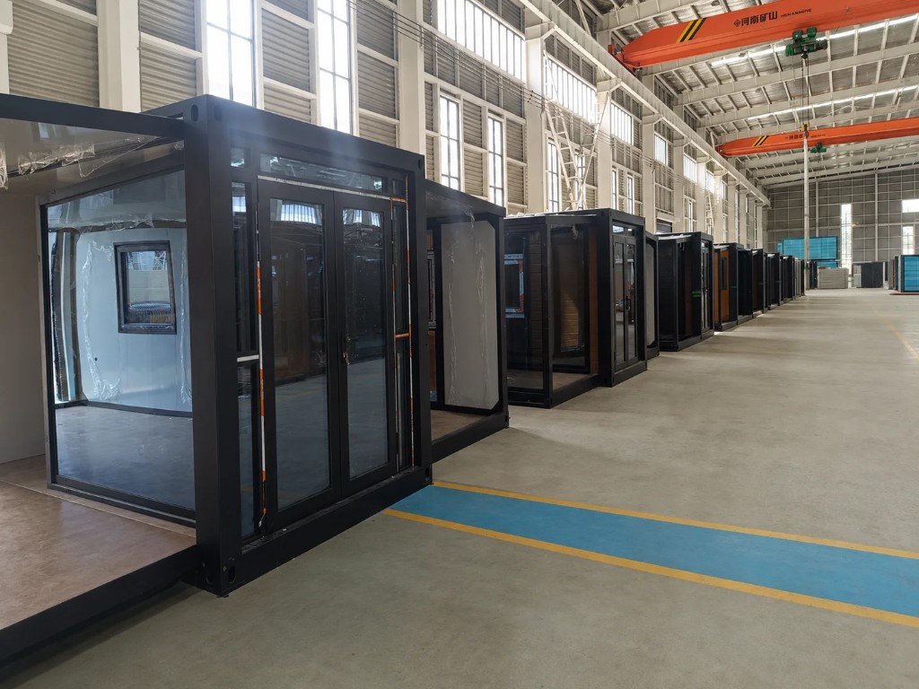 Container houses lined up inside the factory