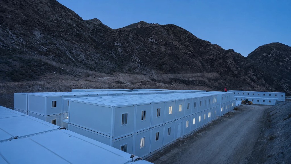 Large modular housing camp at twilight